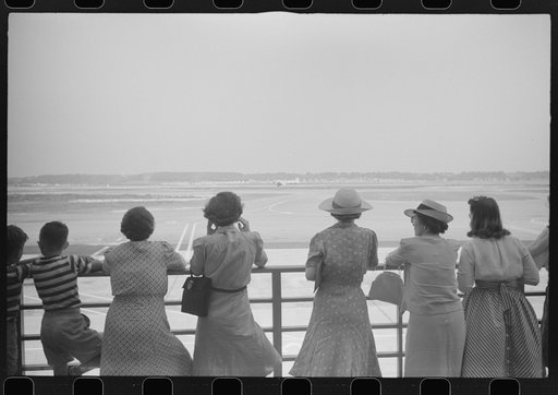 Visitors watching a plane take off at the municipal airport in Washington, D.C.