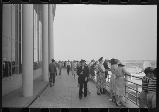 Untitled photo, possibly related to: Visitors watching a plane take off at the municipal airport in Washington, D.C.