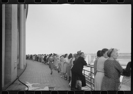Untitled photo, possibly related to: Visitors watching a plane take off at the municipal airport in Washington, D.C.