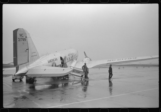 Untitled photo, possibly related to: A plane on the field at the municipal airport on a rainy day, Washington, D.C.