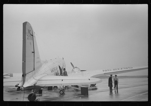 A plane on the field at the municipal airport on a rainy day, Washington, D.C.