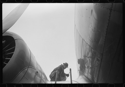 Untitled photo, possibly related to: Checking the fuel on a plane at the municipal airport on a rainy day, Washington, D.C.