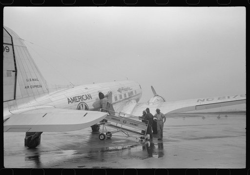 Untitled photo, possibly related to: A plane on the field at the municipal airport on a rainy day, Washington, D.C.