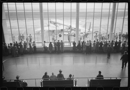 Untitled photo, possibly related to: Visitors watching planes. Seen from waiting platform at the municipal airport in Washington, D.C.