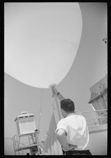 Untitled photo, possibly related to: Preparing to send up the weather balloon at the weather bureau at the municipal airport in Washington, D.C.