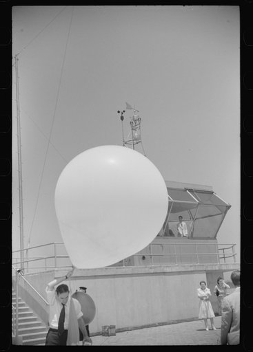 Untitled photo, possibly related to: Preparing to send up the weather balloon at the weather bureau at the municipal airport in Washington, D.C.