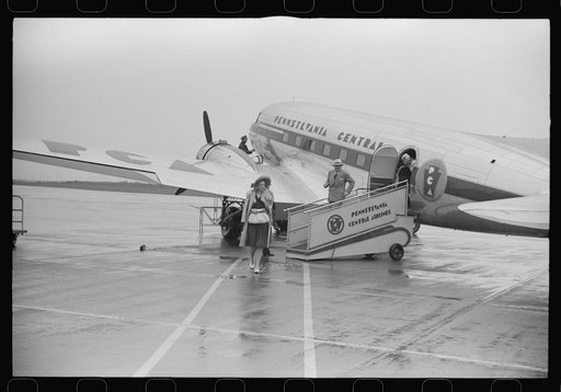 Passengers boarding a plane on a rainy day at the municipal airport in Washington, D.C.