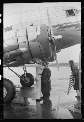 Untitled photo, possibly related to: Ground crew assistants leaving a plane about to take off at the municipal airport in Washington, D.C.