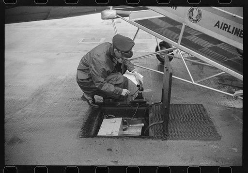 Untitled photo, possibly related to: Receiving weather report through the underground communication system at the field of the municipal airport in Washington, D.C.