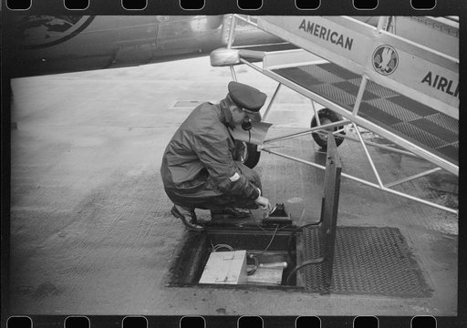 Untitled photo, possibly related to: Receiving weather report through the underground communication system at the field of the municipal airport in Washington, D.C.