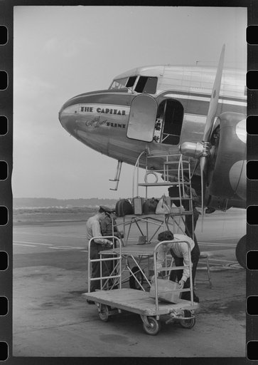 Loading baggage on a plane at the municipal airport in Washington, D.C.
