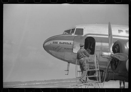 Untitled photo, possibly related to: Loading baggage on a plane at the municipal airport in Washington, D.C.