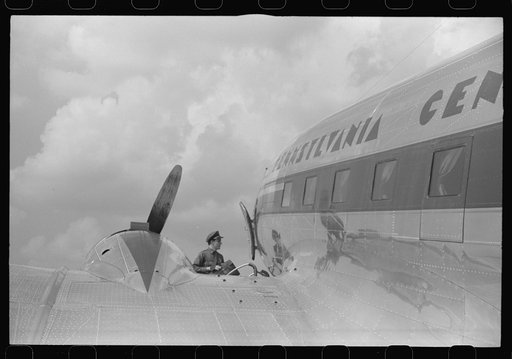 Untitled photo, possibly related to: Loading baggage on a plane at the municipal airport in Washington, D.C.