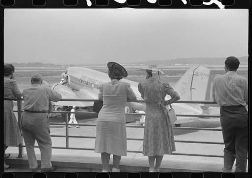Visitors watching a plane from the observation platform at the municipal airport in Washington, D.C.