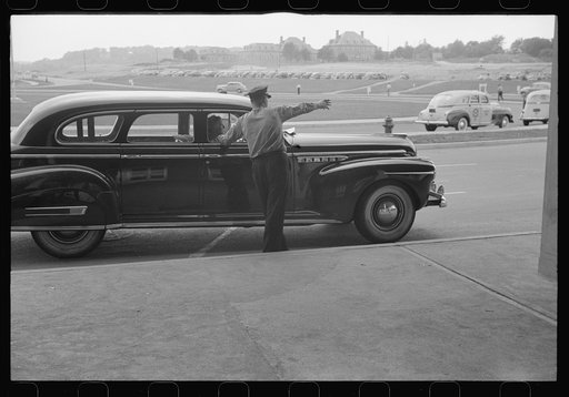 Getting directions from a policeman at the municipal airport in Washington, D.C.