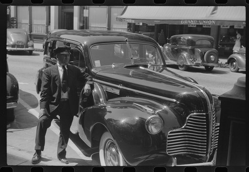 Untitled photo, possibly related to: Chauffeur waiting on the main street of Brattleboro, Vermont