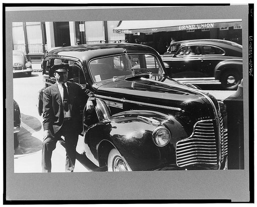 Chauffeur waiting on the main street of Brattleboro, Vermont