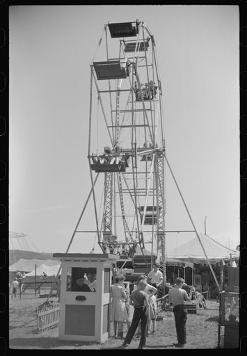 Untitled photo, possibly related to: Merry-go-round [i.e. ferris wheel] at a small American Legion carnival near Bellows Falls, Vermont