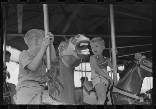 On the merry-go-round of a small American Legion carnival just outside Bellows Falls, Vermont