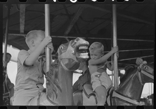 Untitled photo, possibly related to: On the merry-go-round of a small American Legion carnival just outside Bellows Falls, Vermont