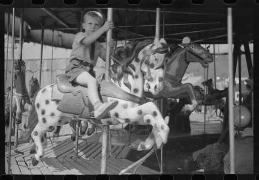 Untitled photo, possibly related to: On the merry-go-round of a small American Legion carnival just outside Bellows Falls, Vermont