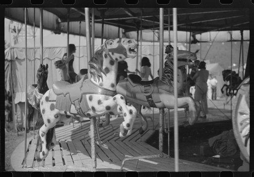 Untitled photo, possibly related to: On the merry-go-round of a small American Legion carnival just outside Bellows Falls, Vermont