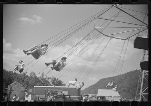 Untitled photo, possibly related to: On the merry-go-round of a small American Legion carnival just outside Bellows Falls, Vermont