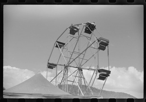 Untitled photo, possibly related to: Merry-go-round at a small American Legion carnival near Bellows Falls, Vermont