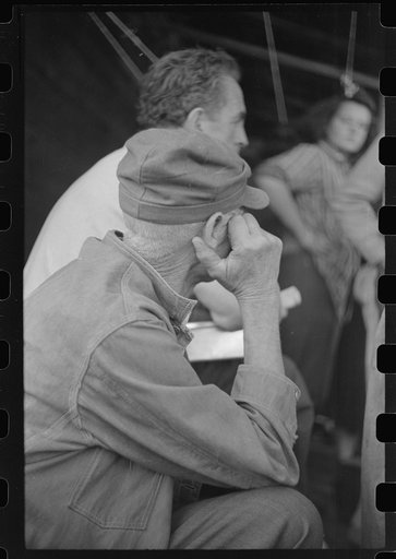 Untitled photo, possibly related to: Spectator at an auction in East Albany, Vermont