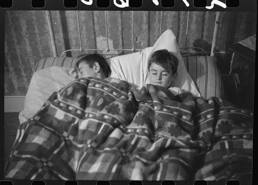 Untitled photo, possibly related to: Two of the Gaynor children going to bed on their farm near Fairfield, Vermont