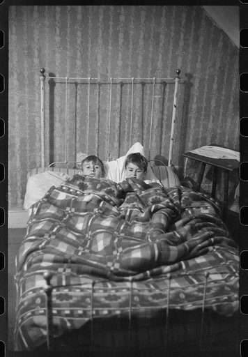 Two of the Gaynor children going to bed on their farm near Fairfield, Vermont