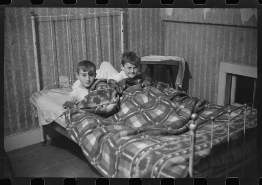 Untitled photo, possibly related to: Two of the Gaynor children going to bed on their farm near Fairfield, Vermont