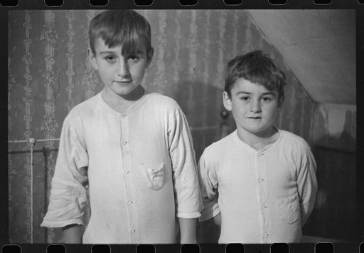 Untitled photo, possibly related to: Two of the Gaynor children going to bed on their farm near Fairfield, Vermont