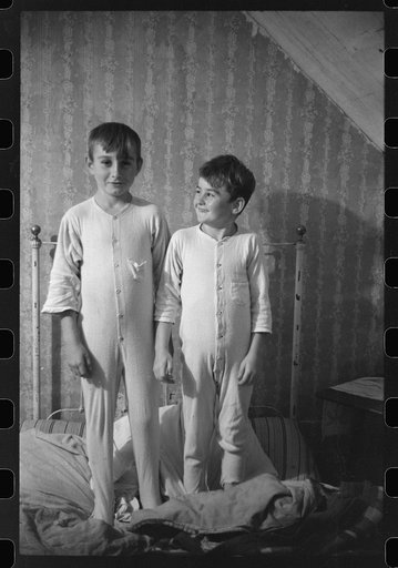 Two of the Gaynor children going to bed on their farm near Fairfield, Vermont