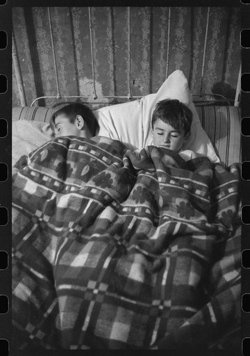 Untitled photo, possibly related to: Two of the Gaynor children going to bed on their farm near Fairfield, Vermont