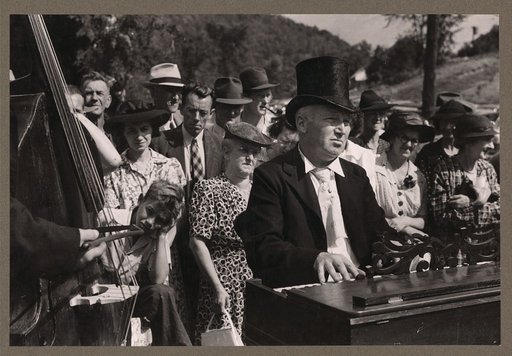 Playing on old organ for the period dances at the "World's Fair" in Tunbridge, Vermont