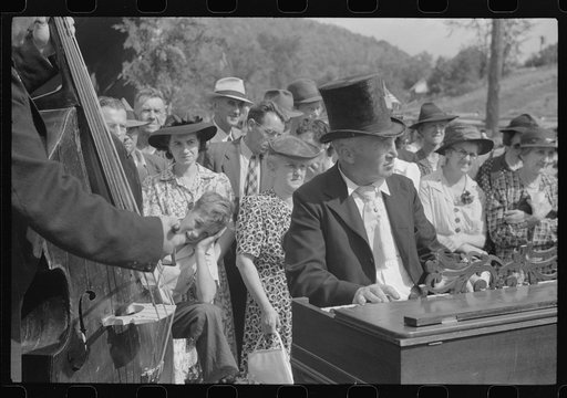 Untitled photo, possibly related to: Playing on old organ for the period dances at the "World's Fair" in Tunbridge, Vermont