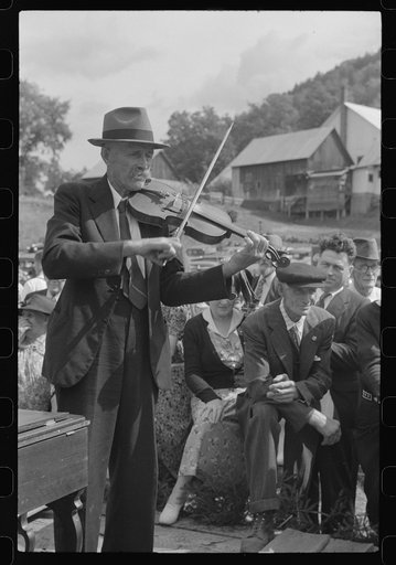 Untitled photo, possibly related to: Playing on old organ for the period dances at the "World's Fair" in Tunbridge, Vermont