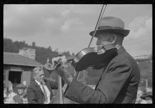 Untitled photo, possibly related to: Playing on old organ for the period dances at the "World's Fair" in Tunbridge, Vermont