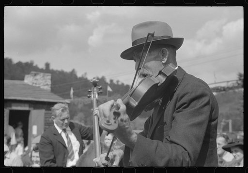 Untitled photo, possibly related to: Playing on old organ for the period dances at the "World's Fair" in Tunbridge, Vermont