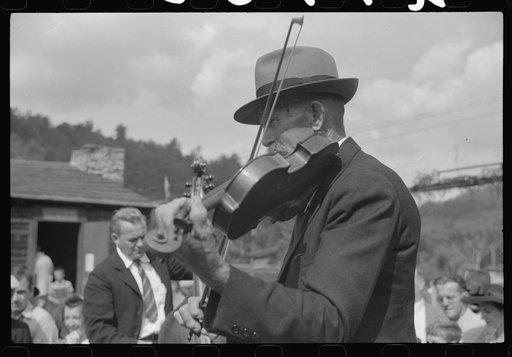Untitled photo, possibly related to: Playing on old organ for the period dances at the "World's Fair" in Tunbridge, Vermont