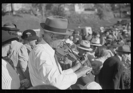 Untitled photo, possibly related to: Playing on old organ for the period dances at the "World's Fair" in Tunbridge, Vermont