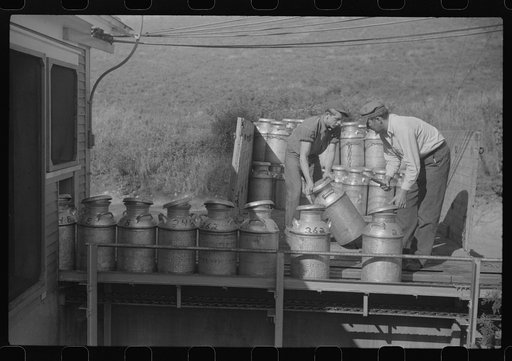 Untitled photo, possibly related to: Opening milk cans at the United Farmers Coop Creamery in East Berkshire, Vermont