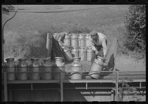 Untitled photo, possibly related to: Opening milk cans at the United Farmers Coop Creamery in East Berkshire, Vermont