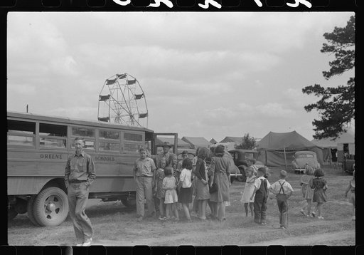 Untitled photo, possibly related to: Schoolchildren getting off the bus for free day at the fair. Greene County, Georgia
