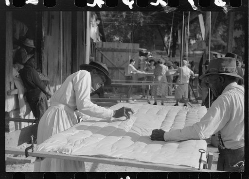 Untitled photo, possibly related to: Making a quilt from surplus commodity cotton in Greensboro, Greene County, Georgia