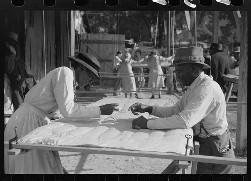 Making a quilt from surplus commodity cotton in Greensboro, Greene County, Georgia