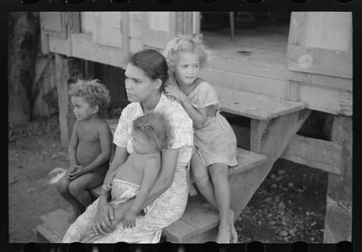 Family in slum area known as "El Machuelitto," in Ponce, Puerto Rico