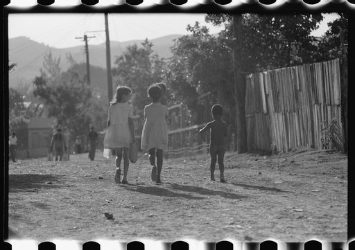 Untitled photo, possibly related to: Street in slum area in Ponce, Puerto Rico. The land on which the houses stand rented from between eighty cents and a dollar a lot per month. Each person built his own house. They had to pay twenty cents per month for water