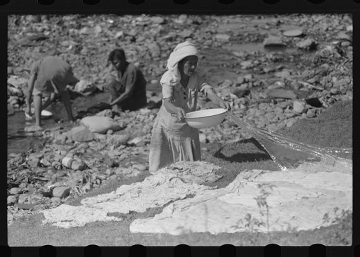 Untitled photo, possibly related to: Washing clothes in the river near the slum area known as "El Machuelitto" in Ponce, Puerto Rico